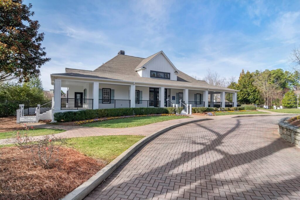 Leasing office exterior with brick paved drive