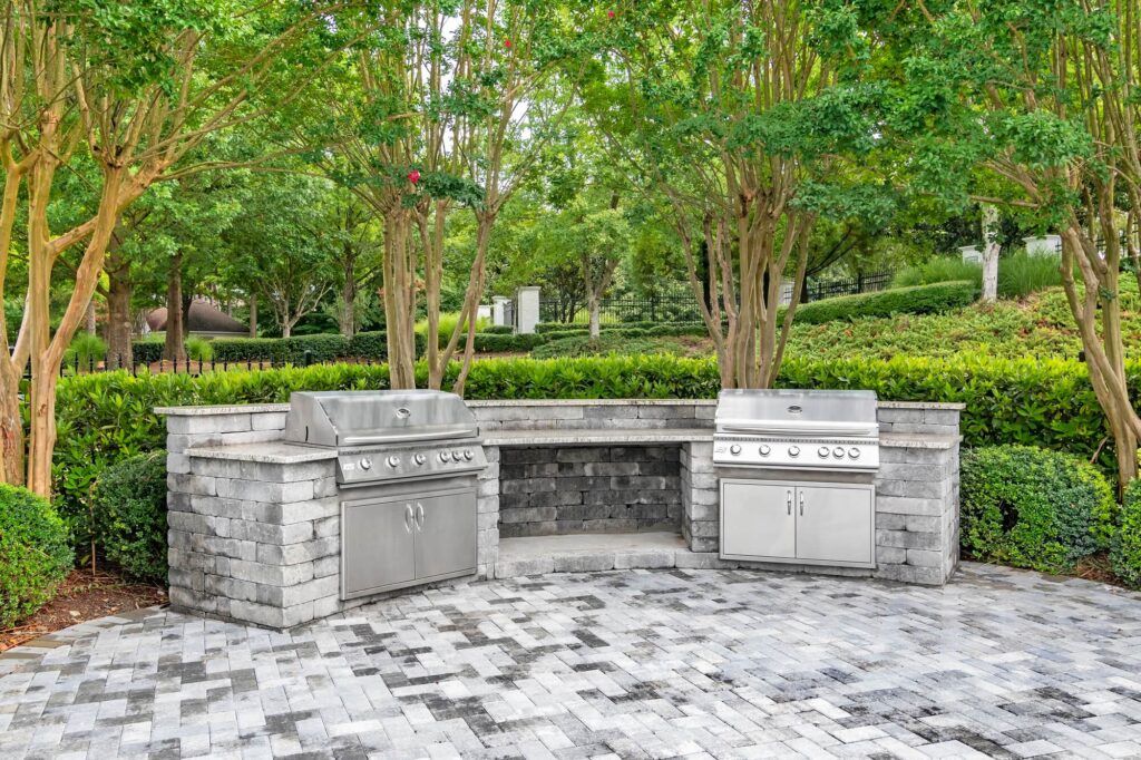 Outdoor grilling area with two gas grills