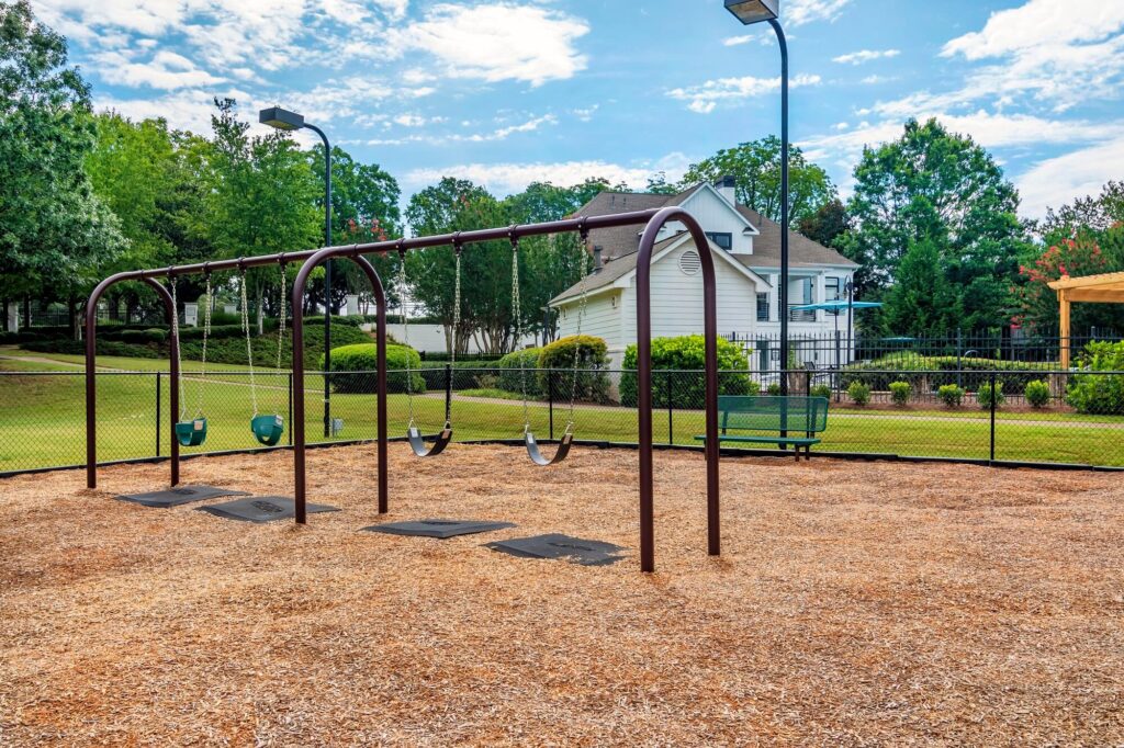 Children's playground with with swings and benches