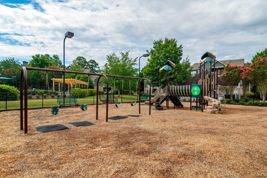 Children's playground with swings, slides, and climbing structures