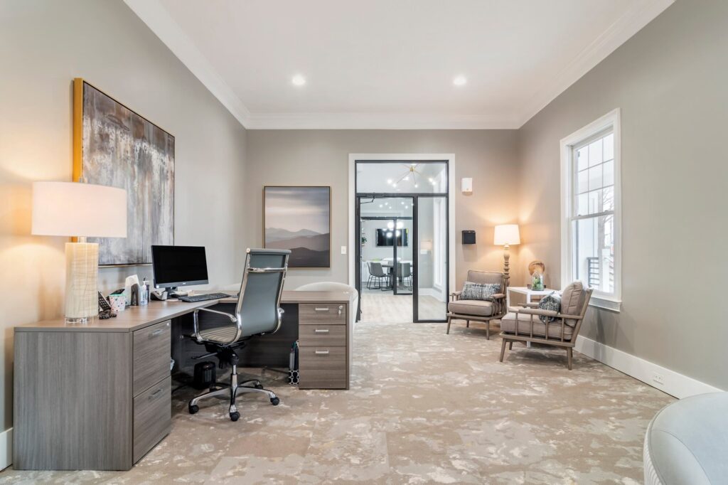 Leasing office with reception desk and lounge seating